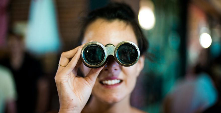 Woman Looking at Binoculars Woman Looking at Binoculars
